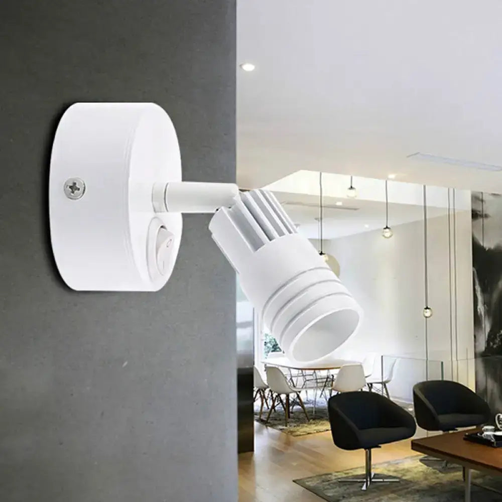 White metal wall spotlight with adjustable cylindrical head on round backplate on Tampa Home & Garden Store