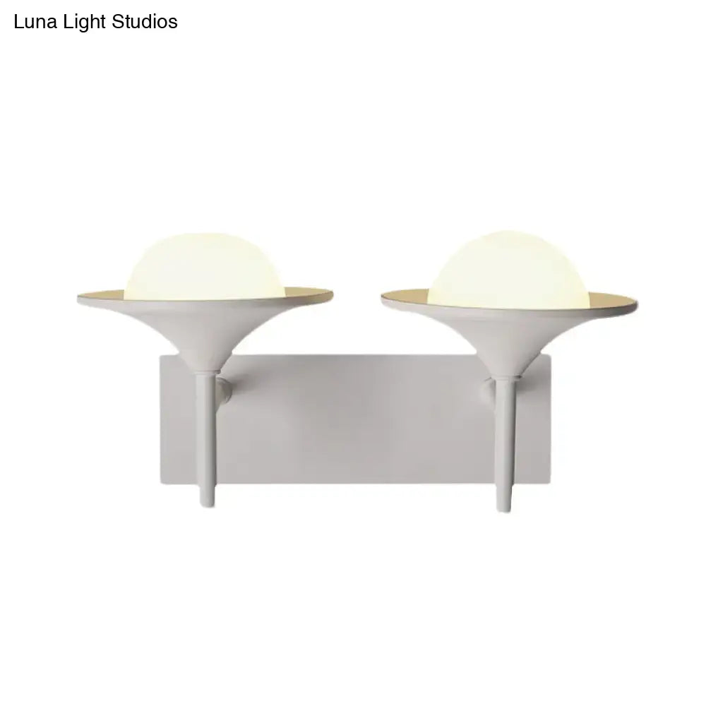 White flared wall sconce with dual frosted globe lights on Tampa Home & Garden Store