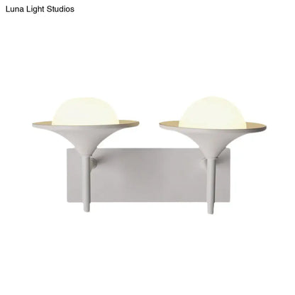 White flared wall sconce with dual frosted globe lights on Tampa Home & Garden Store