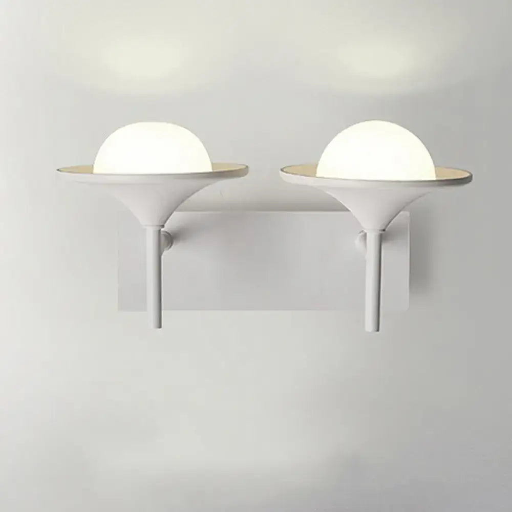 White flared wall sconce pair with frosted globe shades in white metal by Decorbites on Tampa Home & Garden Store