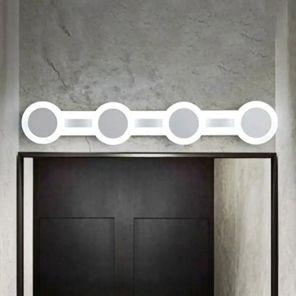 White vanity wall sconce with four connected circular rings, Decorbites fixture on Tampa Home & Garden Store