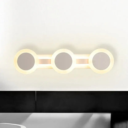 Decorbites white vanity wall sconce with three interconnected circular LED rings on Tampa Home & Garden Store