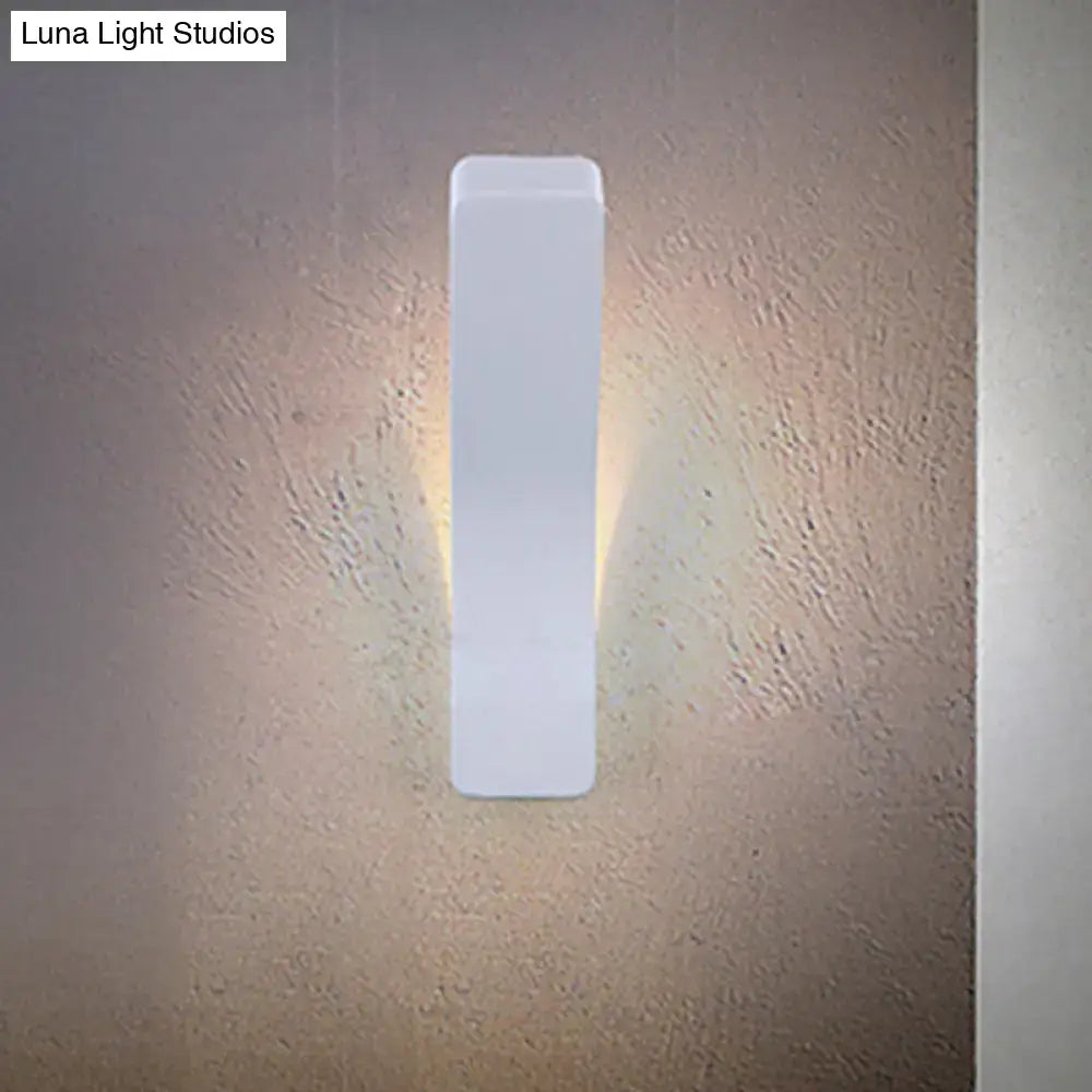 White rectangular corridor wall light sconce, slim vertical design with warm glow against textured wall on Tampa Home & Garden Store