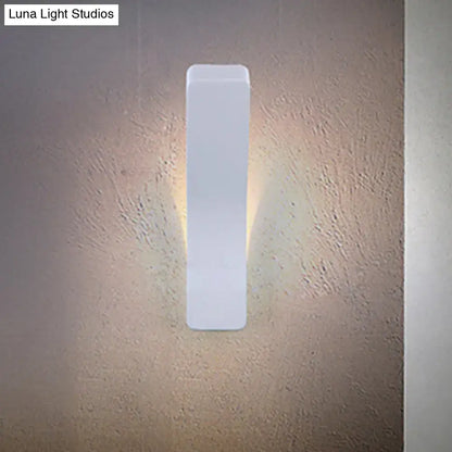 White rectangular corridor wall light sconce, slim vertical design with warm glow against textured wall on Tampa Home & Garden Store
