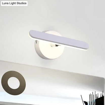 White modern vanity light with lavender oval bar on round white wall mount on Tampa Home & Garden Store