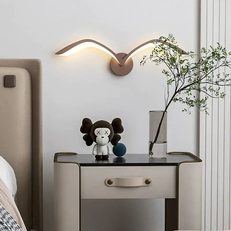 White Nordic Wing Sconce wall light by Decorbites, curved wing design with warm glow on Tampa Home & Garden Store