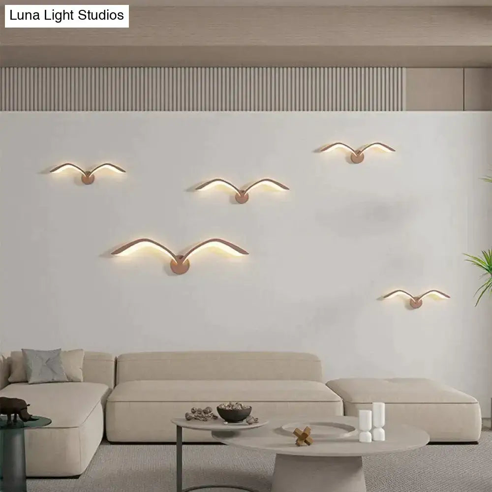 White Nordic Wing Sconce wall light set of five with copper mounts and warm glow on wall on Tampa Home & Garden Store