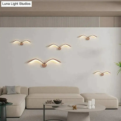 White Nordic Wing Sconce wall light set of five with copper mounts and warm glow on wall on Tampa Home & Garden Store