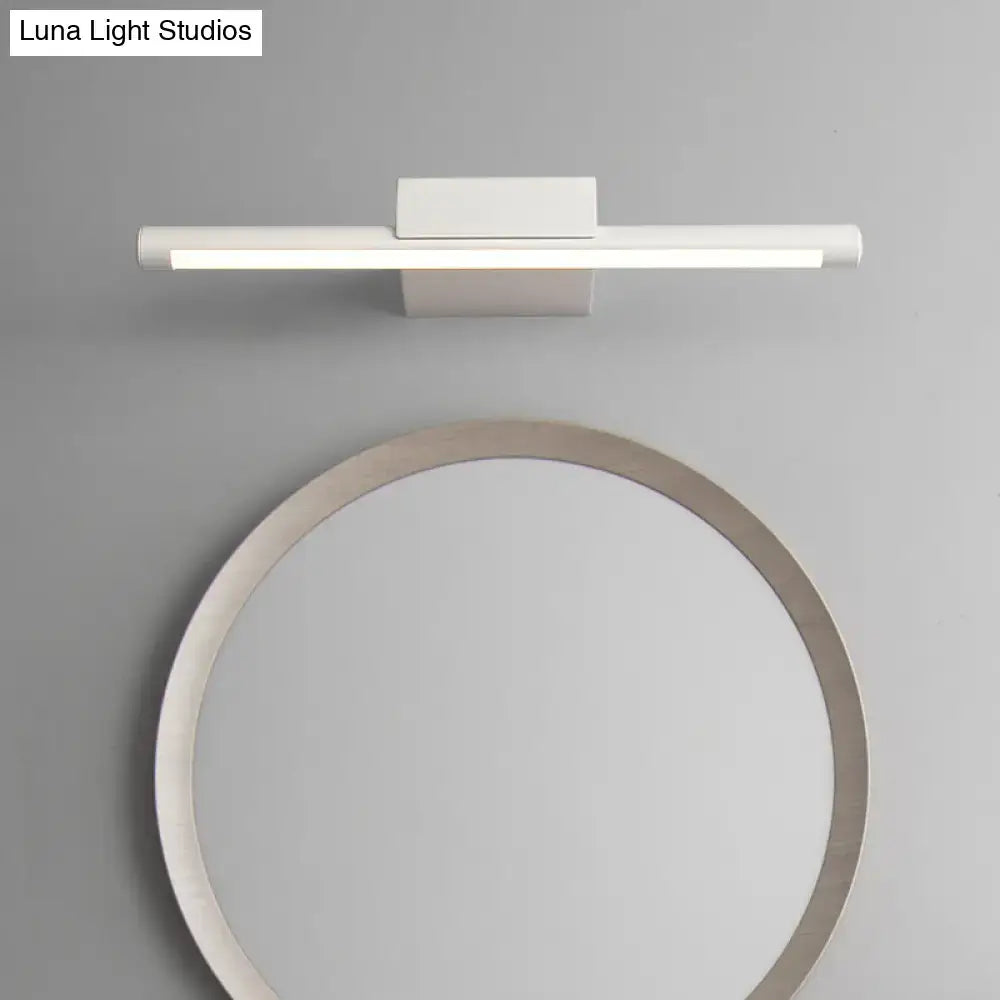 White LED pole vanity wall light by Decorbites, sleek fixture above a round mirror on Tampa Home & Garden Store