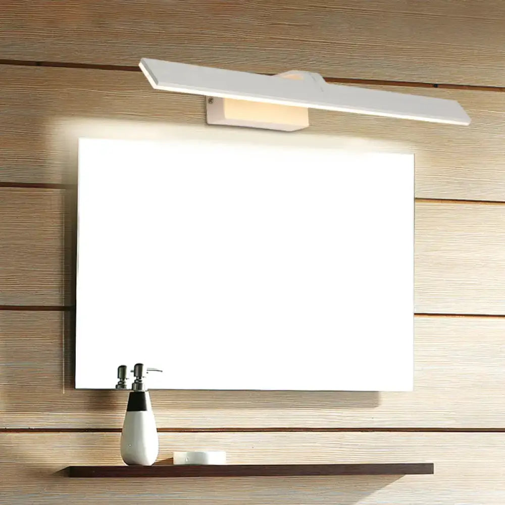 White rectangle LED wall light by Decorbites above square mirror with two shelf items on Tampa Home & Garden Store