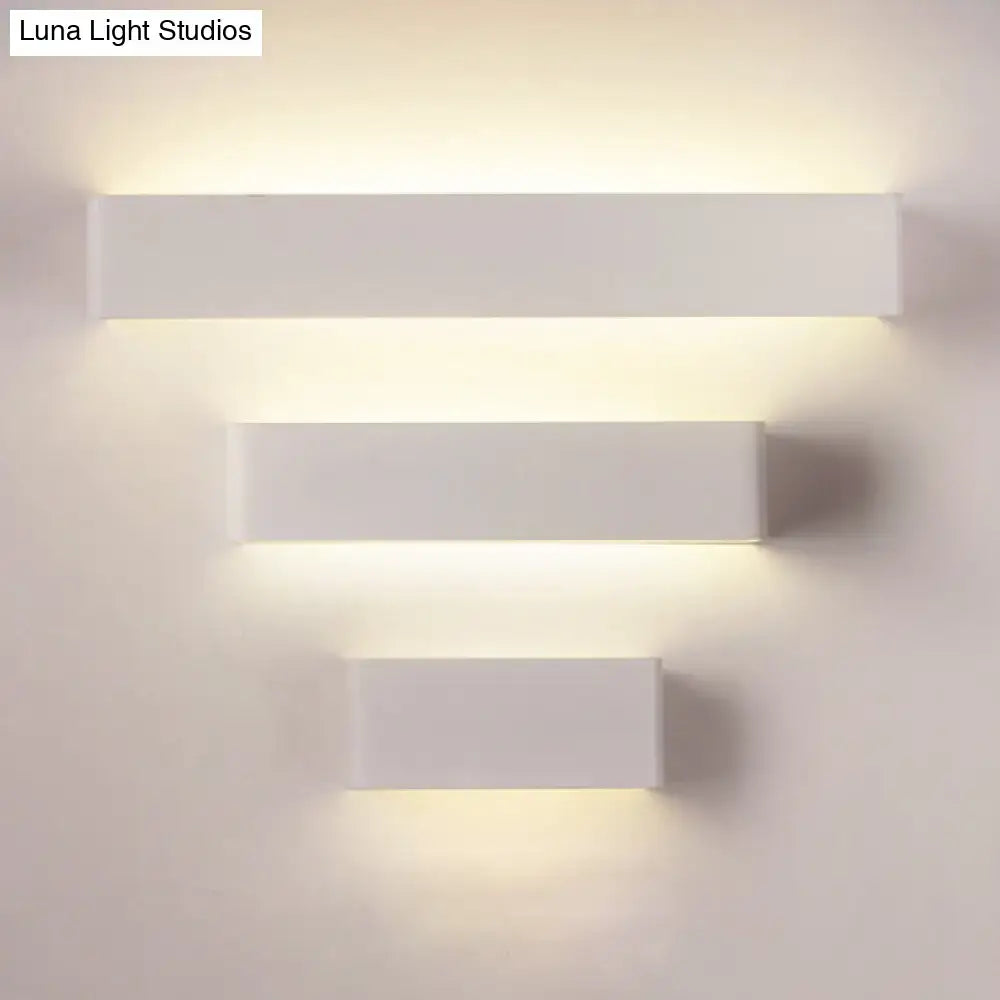 Rectangular wall lamp trio in white finish with warm backlight on wall on Tampa Home & Garden Store