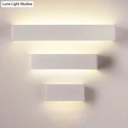 Rectangular wall lamp trio in white finish with warm backlight on wall on Tampa Home & Garden Store
