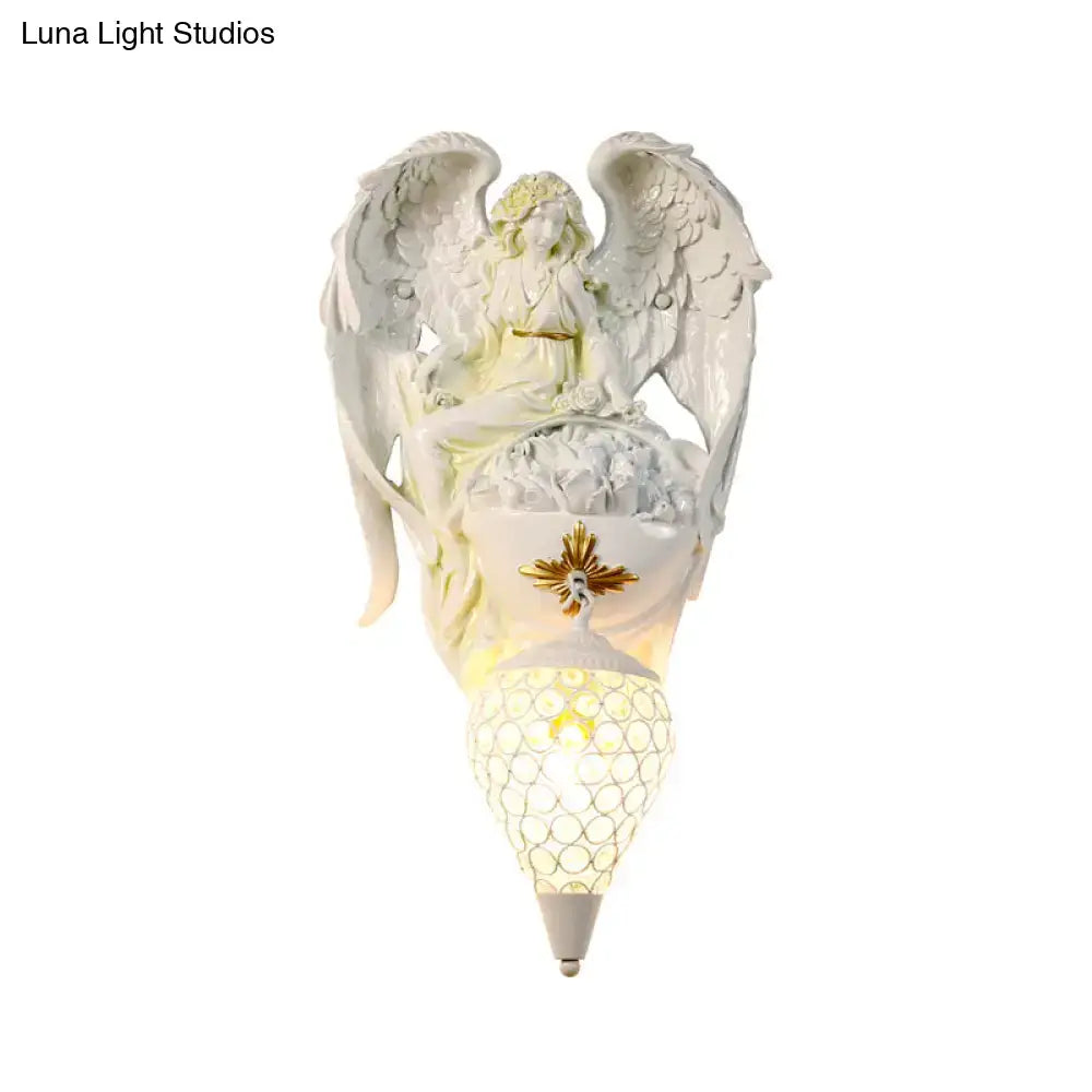 White resin angel wall light with honeycomb mesh shade Decorbites on Tampa Home & Garden Store