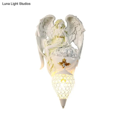 White resin angel wall light with honeycomb mesh shade Decorbites on Tampa Home & Garden Store