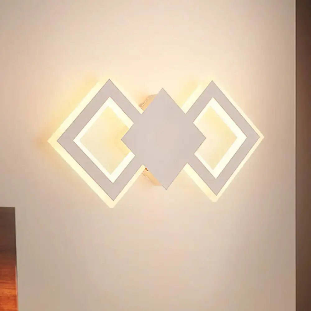 White metal LED wall sconce by Decorbites with interlocking diamond frames and warm glow on Tampa Home & Garden Store