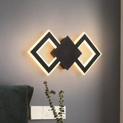 White metal LED wall sconce with geometric interlocking diamonds by Decorbites on Tampa Home & Garden Store