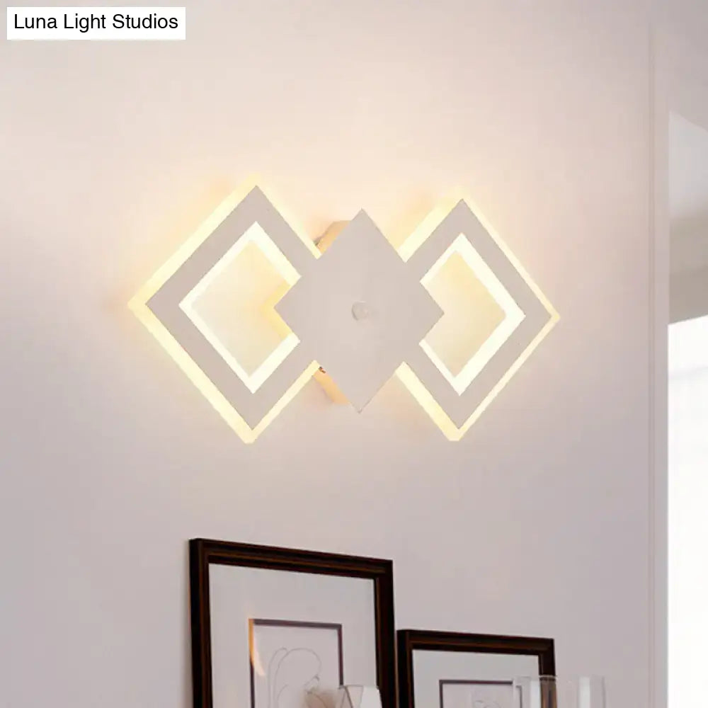 White metal LED wall sconce with interlocking diamond frames by Decorbites on Tampa Home & Garden Store