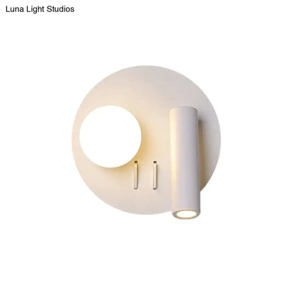 White round wall sconce with cylindrical light fixture by Decorbites on Tampa Home & Garden Store