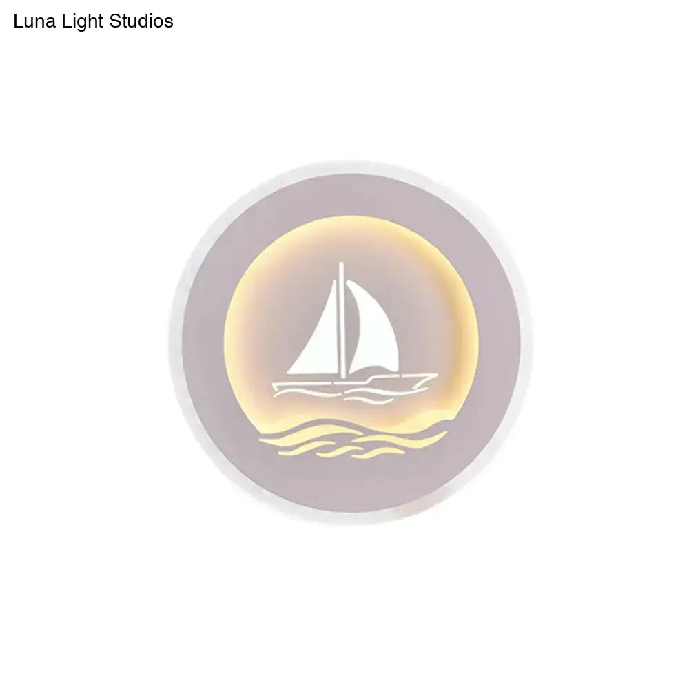 White Sailboat Wall Sconce by Decorbites, round lavender backplate with warm gold glow on Tampa Home & Garden Store