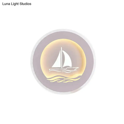 White Sailboat Wall Sconce by Decorbites, round lavender backplate with warm gold glow on Tampa Home & Garden Store