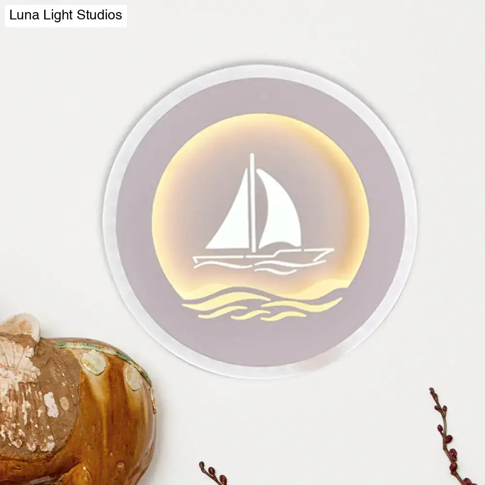White Sailboat Wall Sconce by Decorbites, round purple backplate with warm gold glow on Tampa Home & Garden Store