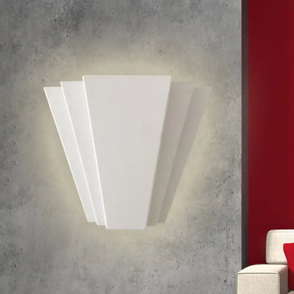 White Sector Wall Sconce; white metal, angular multi-panel design with soft glow on wall on Tampa Home & Garden Store