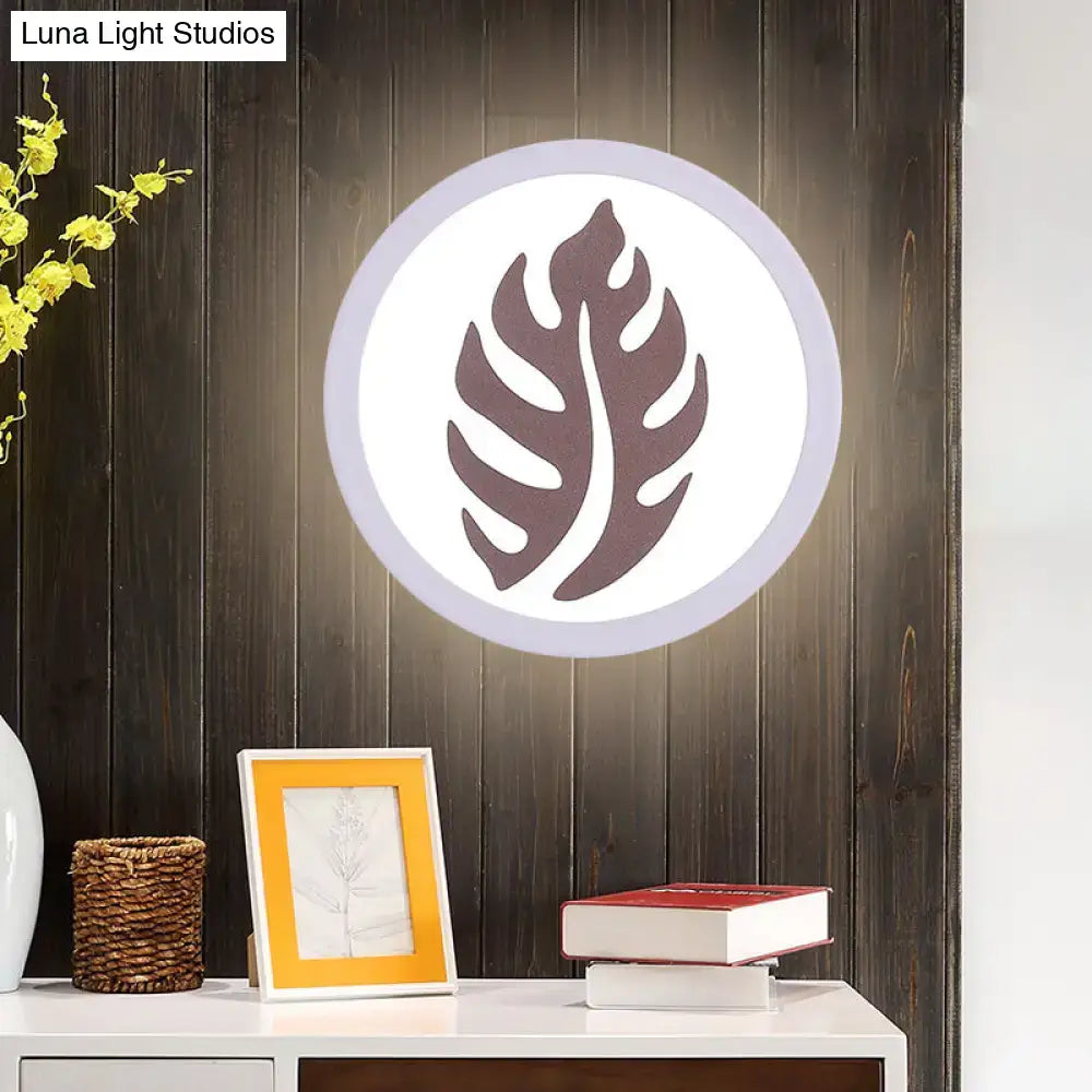 White Leaf Wall Light by Decorbites, white frame with brown leaf cutout on dark wood on Tampa Home & Garden Store