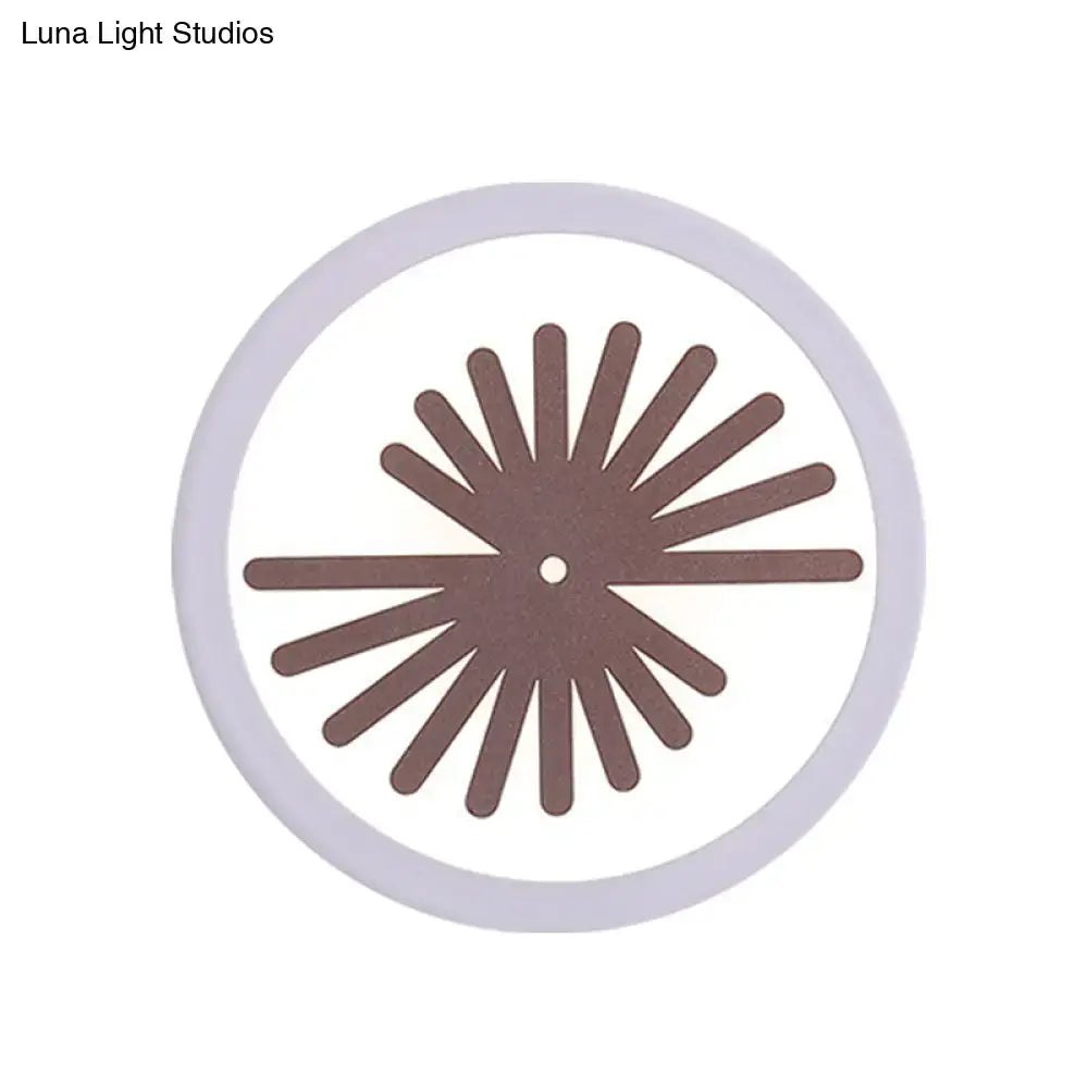 White Leaf Wall Light by Decorbites, round white fixture with brown sunburst leaf pattern on Tampa Home & Garden Store
