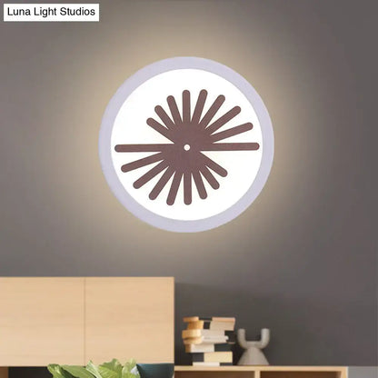White leaf wall light Decorbites with circular shade and brown sunburst spokes on wall on Tampa Home & Garden Store