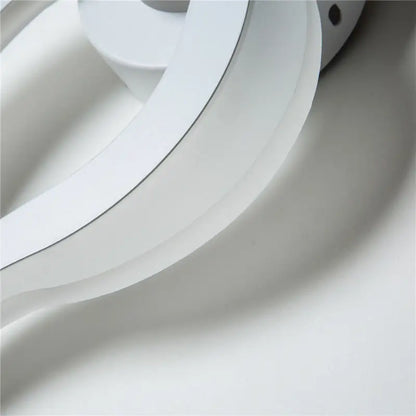 White spiral LED sconce by Decorbites, circular wall light with glossy finish on Tampa Home & Garden Store