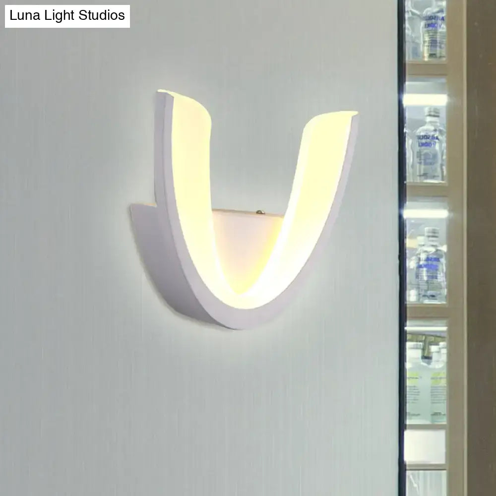 White U-shaped wall sconce with warm inner glow, Decorbites lighting fixture on Tampa Home & Garden Store