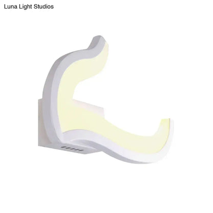 White U-shaped wall sconce with curved crescent design, modern home lighting on Tampa Home & Garden Store