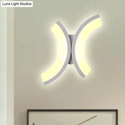 White U-Shaped wall sconce with dual curved LED panels emitting warm glow on Tampa Home & Garden Store