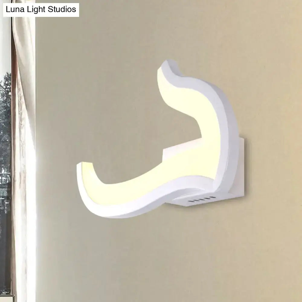 White U-shaped wall sconce by Decorbites with curved silhouette and soft LED glow on Tampa Home & Garden Store