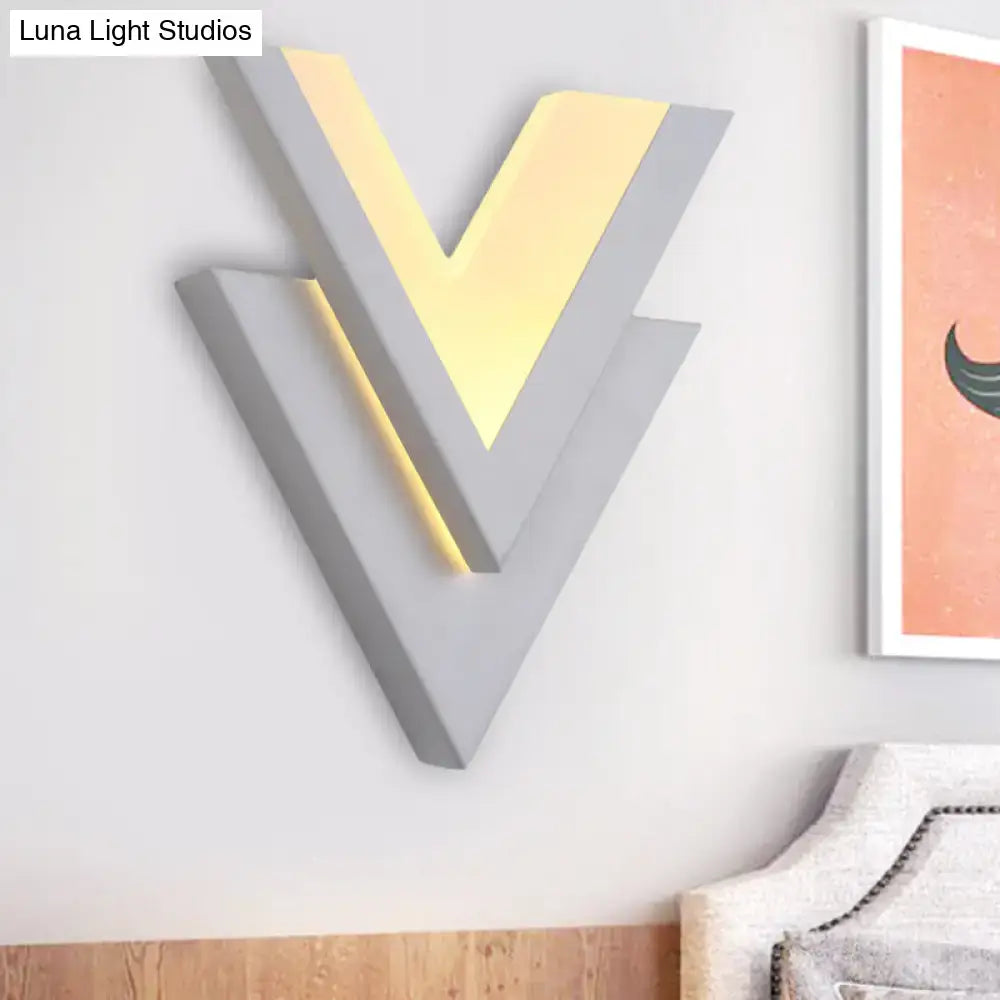 White V-Neck Wall Sconce by Decorbites, grey geometric layered V with warm glow on Tampa Home & Garden Store