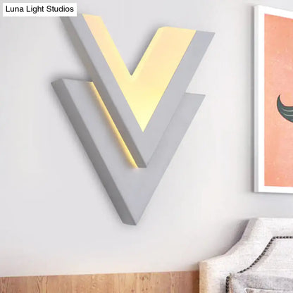 White V-Neck Wall Sconce by Decorbites, grey geometric layered V with warm glow on Tampa Home & Garden Store