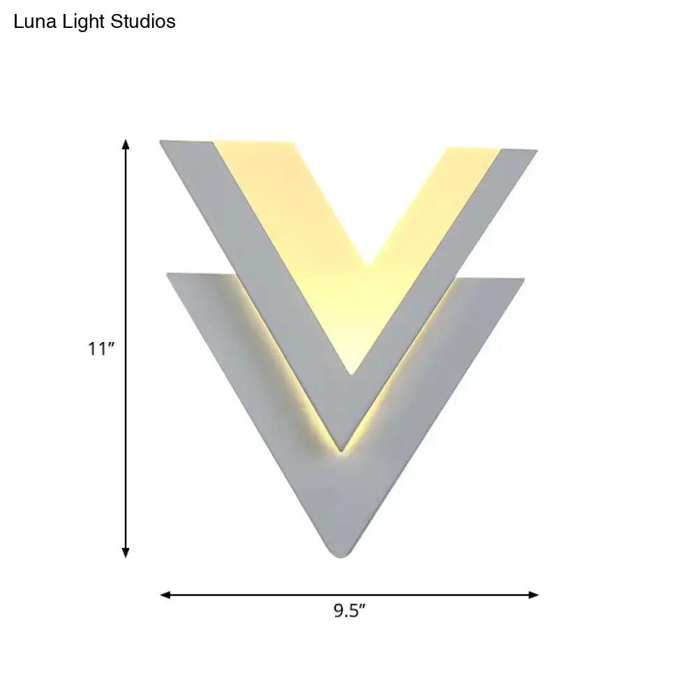 White V-shaped wall light with layered chevrons and warm backlit glow; 11in tall, 9.5in wide on Tampa Home & Garden Store