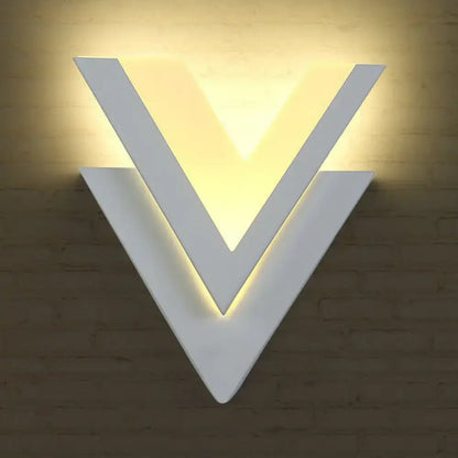 White V-Shaped LED wall sconce by Decorbites with warm backlit glow on Tampa Home & Garden Store