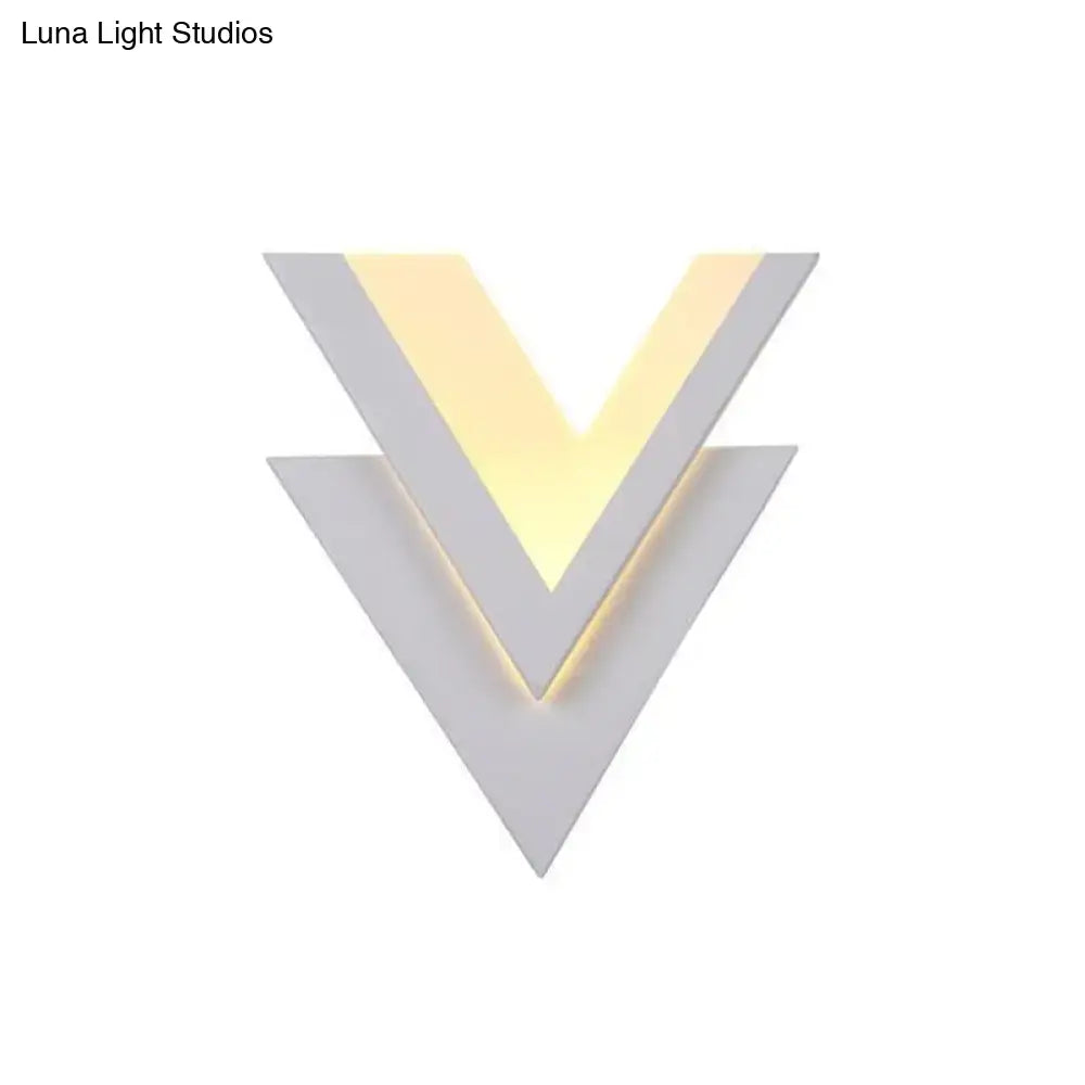 White V-shaped LED wall sconce by Decorbites with layered chevron design and warm glow on Tampa Home & Garden Store