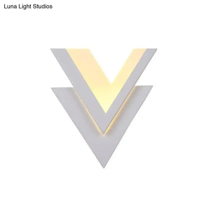 White V-shaped LED wall sconce by Decorbites with layered chevron design and warm glow on Tampa Home & Garden Store