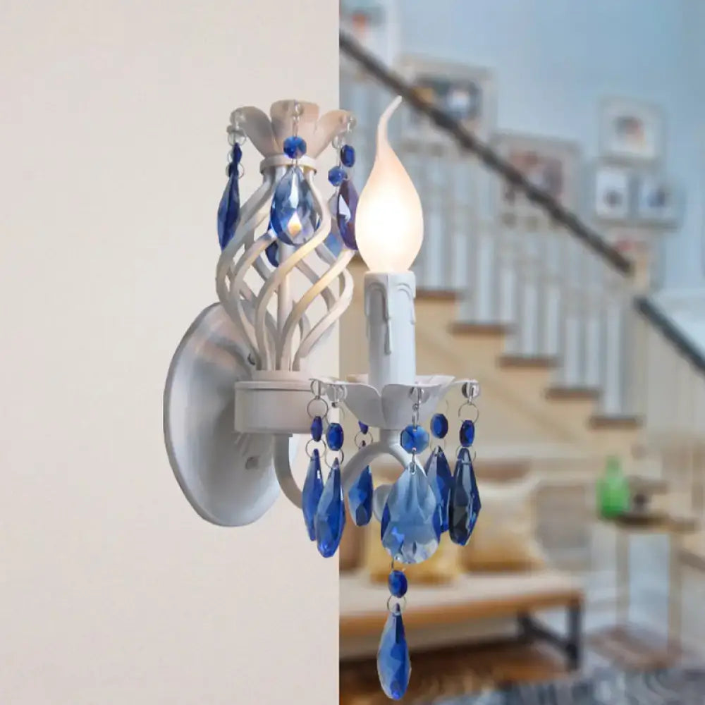 White Crystal Wall Sconce by Decorbites with blue crystal drops and candle-style bulb on Tampa Home & Garden Store