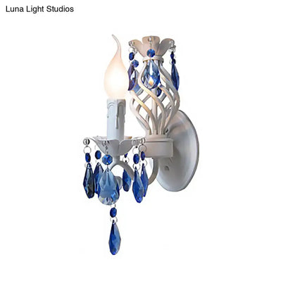 White Crystal Wall Sconce by Decorbites, candle-style light with blue chandelier prisms on Tampa Home & Garden Store