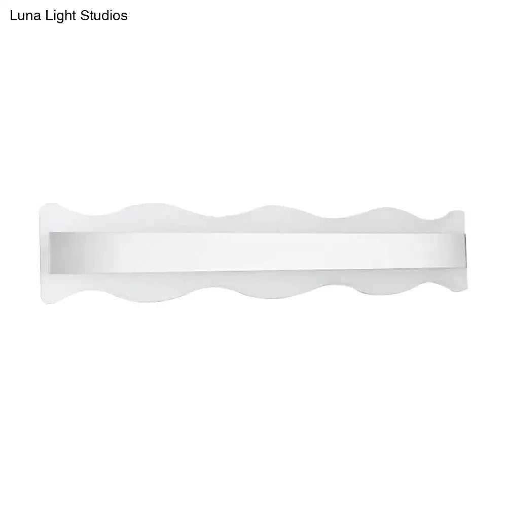 Modern white wave LED bathroom sconce with a slim horizontal light bar on Tampa Home & Garden Store