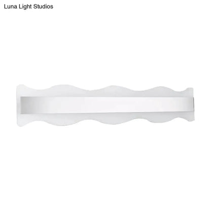 Modern white wave LED bathroom sconce with a slim horizontal light bar on Tampa Home & Garden Store