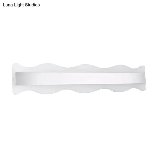 Modern white wave LED bathroom sconce with a slim horizontal light bar on Tampa Home & Garden Store