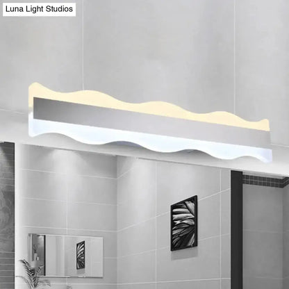 Modern white wave LED bathroom sconce with warm white glow Decorbites on Tampa Home & Garden Store