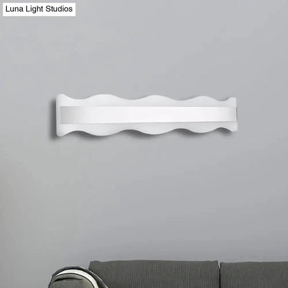 Modern white wave LED wall sconce, wall-mounted bathroom fixture on Tampa Home & Garden Store