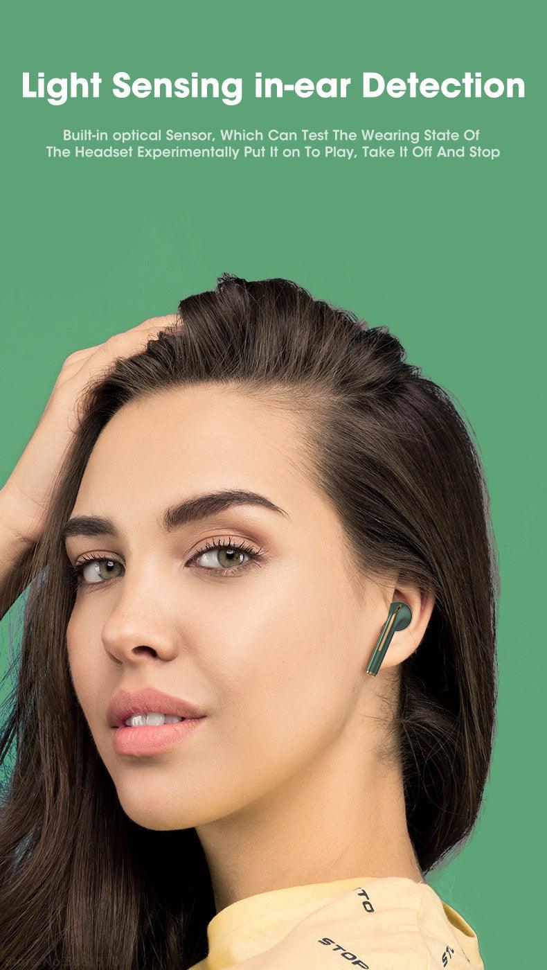 Stevvex wireless in-ear Bluetooth headphones with green accent worn by model on Tampa Home & Garden Store