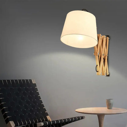 Decorbites wood accordion wall sconce with natural finish and extendable folding arms on Tampa Home & Garden Store