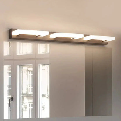 Modern wood acrylic rectangle vanity sconce with three light bars above bathroom mirror on Tampa Home & Garden Store